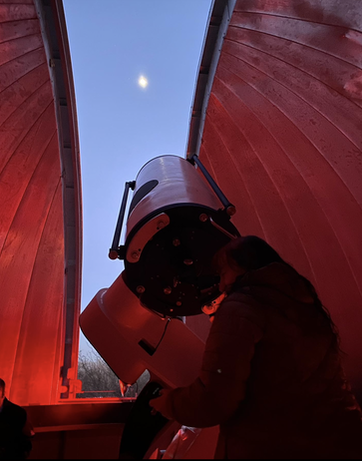 Looking through the telescope at the UConn observatory